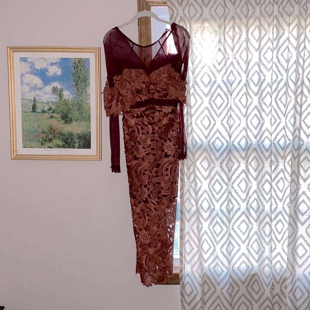Never worn, tags still on beautiful dress by three floor, size 2